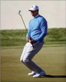  ?? MIKE CARLSON — THE ASSOCIATED PRESS ?? Tiger Woods reacts to a missed putt on the 14th hole during the second round of the Valspar Championsh­ip on Friday in Palm Harbor, Fla.