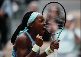  ?? Associated Press ?? Big day: Coco Gauff of the U.S. celebrates winning against Belgium's Elise Mertens in two sets, 6-4, 6-0, during their fourth round match at the French Open in Roland Garros stadium in Paris, France, Sunday.