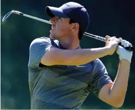  ?? GETTY IMAGES ?? Bogey country: Mcilroy hits an iron to the seventh green