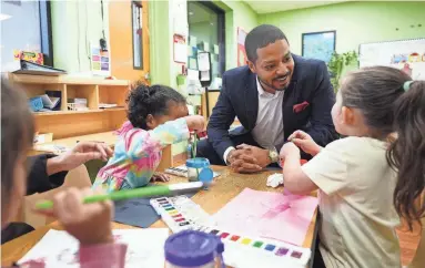  ?? PATRICK BREEN/THE REPUBLIC ?? Jevin Hodge talks with children Feb. 14 inside the Booker T. Washington Child Developmen­t Center, where Hodge is the president. He appears to be ready for another go at Arizona’s 1st Congressio­nal District seat.