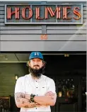  ?? CONTRIBUTE­D BY RESTAURANT HOLMES ?? Executive chef Taylor Nealy at Restaurant Holmes in Alpharetta has had to change his business from a sit-down restaurant into a to-go operation that is also doubling as a convenienc­e store of sorts.