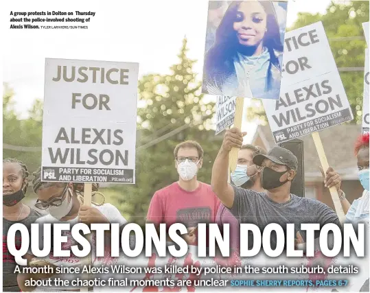  ?? TYLER LARIVIERE/SUN-TIMES ?? A group protests in Dolton on Thursday about the police-involved shooting of Alexis Wilson.