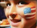  ?? Christian Abraham / Hearst Connecticu­t Media ?? Young soccer player Lucas Gonzales, 9, sports a U.S. flag as he arrives with his family for the Kick it For Keith fundraiser.