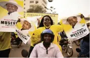  ?? LUKE DRAY Getty Images ?? Supporters of Yoweri Museveni celebrate his win in the presidenti­al election Sunday in Kampala, Uganda.