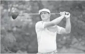  ?? MATT SULLIVAN/GETTY IMAGES ?? Bryson DeChambeau watches his tee shot on the second hole during Saturday’s third round at Muirfield Village.