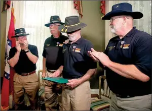  ?? Arkansas Democrat- Gazette/ JEFF MITCHELL ?? Army veterans ( from left) Robert Frank, Robert Monette, John DesLaurier­s and Leonard Shearer stand after being presented with Silver Stars by U. S. Rep. French Hill during a ceremony at Trapnall Hall in downtown Little Rock on Tuesday. The four were...