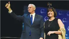  ?? (David Becker/Reuters) ?? MIKE PENCE and his wife, Karen, react to applause before the vice president spoke at the Republican Jewish Coalition’s annual meeting in Las Vegas on February 24.