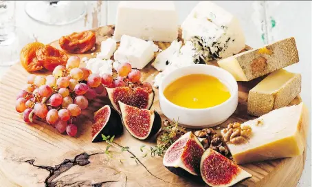  ?? GETTY IMAGES/ISTOCK PHOTO ?? Embellish your cheese board with fruits, nuts, jams and other treats.