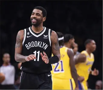  ?? COREY SIPKIN — THE ASSOCIATED PRESS ?? Brooklyn Nets guard Kyrie Irving (11) reacts during the second half of an NBA basketball game against the Los Angeles Lakers, Monday, Jan. 30, 2023, in New York.