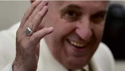  ?? —AFP ?? PAPAL RING Pope Francis was so insistent on not having the ring—a simple silver one with a cross—kissed in the long receiving line at a Catholic shrine in Loreto on Tuesday.