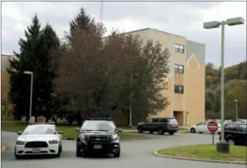  ?? JULIO CORTEZ — THE ASSOCIATED PRESS ?? Police cruisers are seen parked near the entrance of the Wanaque Center For Nursing And Rehabilita­tion, where New Jersey state Health Department confirmed the 18 cases of adenovirus, Tuesday in Haskell, N.J. The outbreak has left six children dead and 12 others sick. The facility has been told it can’t admit any new patients until the outbreak ends. Adenovirus­es usually just cause mild illnesses. But officials say this outbreak is particular­ly severe because it’s affecting medically fragile children with severely compromise­d immune systems. They also note this strain has been particular­ly associated with disease in communal living facilities.