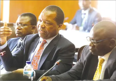  ?? Picture by Justin Mutenda ?? Reserve Bank of Zimbabwe Governor Dr John Mangudya, Zamco chief executive Cosmas Kanhai (right) and Legal Counsel Webster Madera appear before Parliament’s Public Accounts Committee in Harare yesterday. —