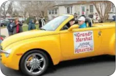  ??  ?? Grand Marshal Judge Frank Peranteau cruises the parade route.