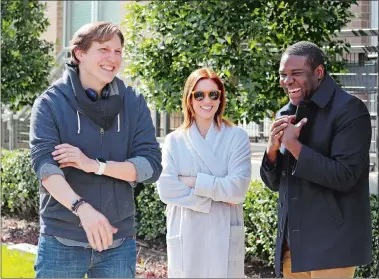  ?? PHOTO BY JAMES CABLE ?? “Hooking Up” director and co-writer Nico Raineau, left, on set with the movie’s stars, Brittany Snow and Sam Richardson.