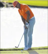  ?? AP PHOTO ?? Rickie Fowler hits from the edge of 18th green during the final round of the Hero World Challenge golf tournament at Albany Golf Club in Nassau, Bahamas, on Sunday.