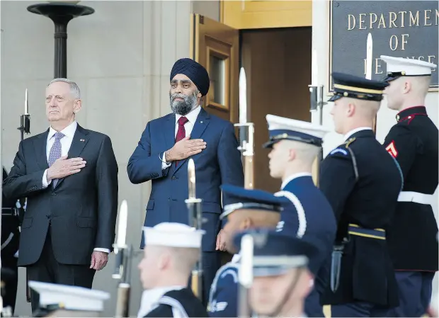  ?? CLIFF OWEN / THE ASSOCIATED PRESS ?? U. S. Defence Secretary Jim Mattis and Canadian Defence Minister Harjit Sajjan at the Pentagon on Monday. It was Sajjan’s first meeting with his newly sworn-in American counterpar­t, and the former soldiers touched on a range of topics including the...