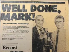  ??  ?? Mark Weicker, right, enjoyed success as a Record carrier. Here, he receives an award from district manager Larry Wilhelm.