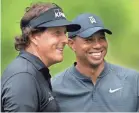  ?? GETTY IMAGES ?? Phil Mickelson, left, and Tiger Woods will play a pay-per-view exhibition on Thanksgivi­ng weekend.