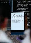  ?? ?? A ‘closed’ sign is pictured at the Tate Modern gallery in London, after reports that a man had died after falling at the gallery. — AFP photo