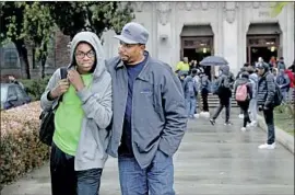  ?? Gary Coronado Los Angeles Times ?? BLAKE ANDERSON, a Hamilton High freshman, and his dad, Oree Anderson, leave campus. Blake is one of 670,000 students affected by the L.A. schools closure.