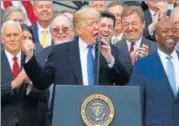  ?? REUTERS ?? President Trump celebrates passage of tax overhaul bill.