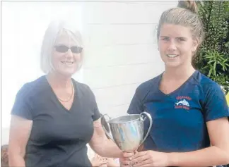  ??  ?? Best overall: Swimming Nelson Marlboroug­h life member Margaret Pattison presents the Ted Hockey Cup for top overall country club swimmer to Pip Dwyer, of Motueka Swim Club, who also dominated the 11-12 years age group.