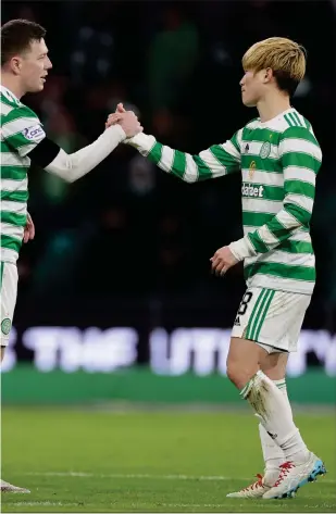  ?? ?? Callum McGregor and Kyogo Furuhashi celebrate after overcoming a solid Aberdeen resistance on Sunday evening
