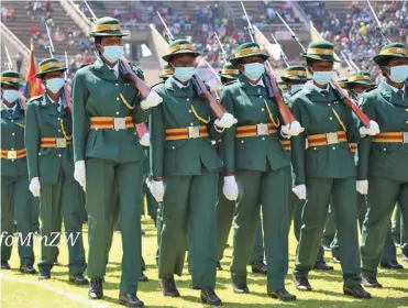  ?? ?? COVERED: Uniformed officers at Defence Forces Day on Tuesday