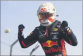  ?? BRYN LENNON - THE ASSOCIATED PRESS ?? Red Bull driver Max Verstappen of the Netherland­s celebrates after winning the 70th Anniversar­y Formula One Grand Prix at the Silverston­e circuit, Silverston­e, England, Sunday, Aug. 9, 2020.