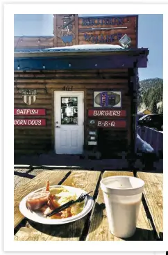  ??  ?? A hearty breakfast outside Shotgun Willie’s, 403 W. Main Street, Red River, where locals go for home fries and morning sunshine.