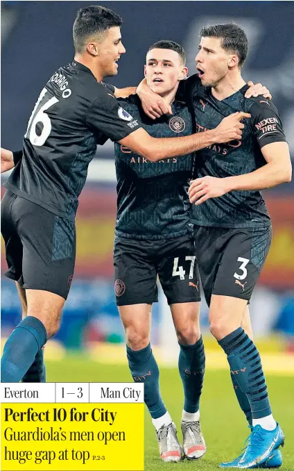  ??  ?? Phil Foden (centre) celebrates with City team-mates Rodri (left) and Ruben Dias after scoring his side’s first at Goodison Park last night