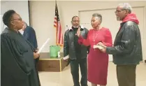  ?? COURTESY ?? Gary City Court Judge Deidre Monroe swears in new Calumet Township Assessor Jackie Collins after a Feb. 22 caucus. Collins is flanked to the right by her husband, Solomon Hammond, and her pastor, the Rev. John Jackson.
