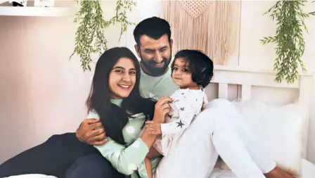  ?? SPECIAL ARRANGEMEN­T ?? Doting father: Cheteshwar Pujara with wife Puja and daughter Aditi. “I spent most of the time with my family. I have a young daughter, and she wants to play all day. I wanted to make sure I am around her,” says the star batsman.