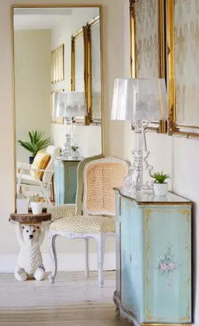 ??  ?? CHIC CORNER Parisian influences are peppered throughout the house. A Kartell lamp adds a contempora­ry feel to the ornate dresser. The polar bear side table is from The French Bedroom Company