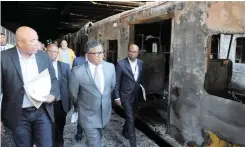  ??  ?? TRANSPORT Minister Fikile Mbalula and Passenger Rail Agency of SA officials conduct an inspection at Cape Town station after 18 train carriages were burnt. |
African News Agency (ANA)