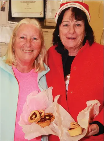  ??  ?? Theresa Garland and Joan Hynes at the Christmas craft fair in Riverchape­l Community Centre.