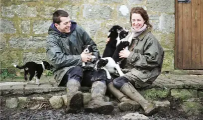  ??  ?? Ewan and Emma with some very playful pups