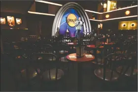  ??  ?? Empty chairs face comedian Alonzo Bodden as he performs April 20 during a “Laughter is Healing” stand-up comedy livestream event at the Laugh Factory in Los Angeles.