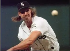  ?? (AP file photo) ?? Seattle pitcher Randy Johnson struck out 19 batters on this date in 1997, but the Mariners fell to the Oakland Athletics 4-1.