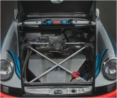  ??  ?? Below: ATL fuel cell dominates under bonnet space – substantia­l crossbraci­ng stiffens shell, as per the original RSR…