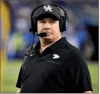  ?? AP/TIMOTHY E. EASLEY ?? Coach Mark Stoops and Kentucky enter Saturday’s game against Arkansas on a three-game losing streak in SEC play. “The guys are very determined to get things fixed,” he said.