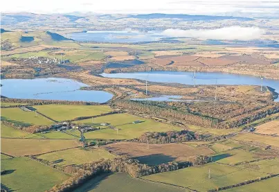  ?? Picture: Aerial Photograph­y Solutions. ?? The former opencast coal mining site at Westfield, with the two main mine workings now flooded and Loch Leven and the Ochil Hills in the distance.