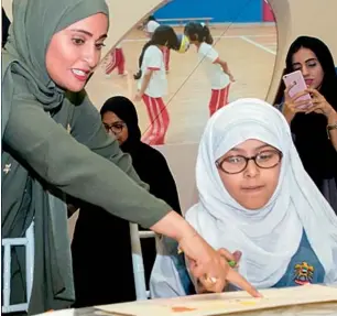  ??  ?? The world’s first Happiness Minister, Ohood Al Roumi, says that happiness is very important for the UAE and a serious job for government­s, tasked with creating an environmen­t people can flourish in.