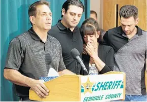  ?? RED HUBER/STAFF PHOTOGRAPH­ER ?? Joe Strada, father, left, and relatives of Daniel Strada, an innocent bystander who was killed by a stray bullet in Lake Mary on Sunday, makes a statement Thursdayat the Seminole County Sheriff’s Office.