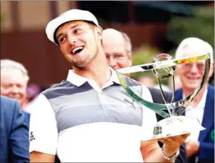  ?? AFP ?? Bryson DeChambeau celebrates with the winner’s trophy after the final round of The Northern Trust on Sunday at the Ridgewood Championsh­ip Course in New Jersey.
