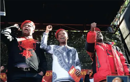  ?? PICTURE: NOKUTHULA MBATHA ?? STANDING UNITED: EFF heavyweigh­ts, from left, Floyd Shivambu, Julius Malema and Dali Mpofu, at the Africa Day celebratio­ns in Joubert Park, Joburg, yesterday. Zimbabwean President Robert Mugabe