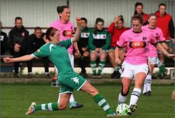  ??  ?? Megan Bourque of Cork City stretches in this tussle with Edel Kennedy of Wexford Youths.