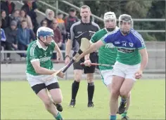  ??  ?? Cloughbawn’s Tomas Furlong battles with Gary Moore of Glynn-Barntown.