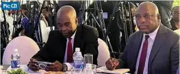  ?? ?? Pic: CZI
From left: Confederat­ion of Zimbabwe Industries (CZI) president Kurai Matsheza and Reserve Bank of Zimbabwe governor John Mushayavan­hu at the CZI’s Monetary Policy review and Economic Outlook Symposium in Harare yesterday