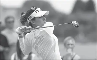  ?? NWA Democrat-Gazette/J.T. Wampler ?? LOCAL FAVORITE: Former Arkansas Razorback golfer Gaby Lopez watches her tee shot on No. 9 at Rogers’ Pinnacle Country Club in the second round of the Walmart NW Arkansas LPGA tournament Saturday. Lopez shot her second 3-under 68 and, at 136, trailed...